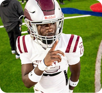 Action shot of a Riverview High School football player running with the ball, showcasing athletic talent for college coaches.